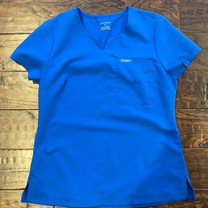 Jaanuu 3-pocket notch-neck scrub top